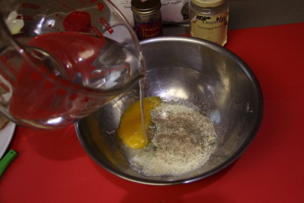 Pouring boiling hot water over potato filling ingredients