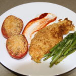 Plated Air Fryer Potato Crusted Fish Filets with Baked Tomatoes and Asparagus