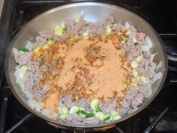 Taco seasoning added to cooked ground turkey with onions and chopped zucchini.