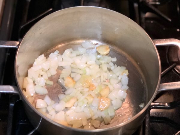 Sauté garlic and onions with olive oil in sauce pan.