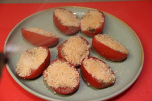 Spray oil onto prepared tomato halves using EVO Oil Sprayer.