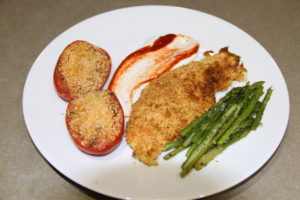 Plated Air Fryer Potato Crusted Fish Filets with Baked Tomatoes and Asparagus