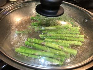 Poaching Asparagus Spears in white wine.