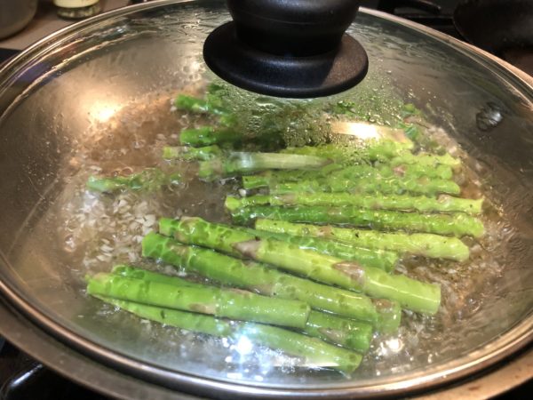 Poaching Asparagus Spears in white wine.