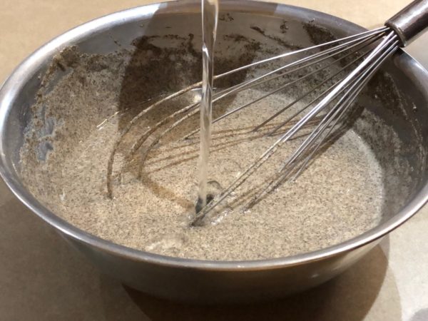 Adding water to Buckwheat Crepe batter.
