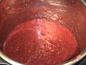 Cooking Strawberry Rhubarb Sauce to just right consistency. About 10 minutes in sauté mode,