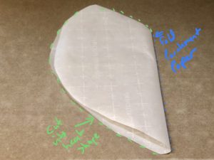 Cut 24 inch piece of parchment paper. Then fold in half and cut into heart shape.