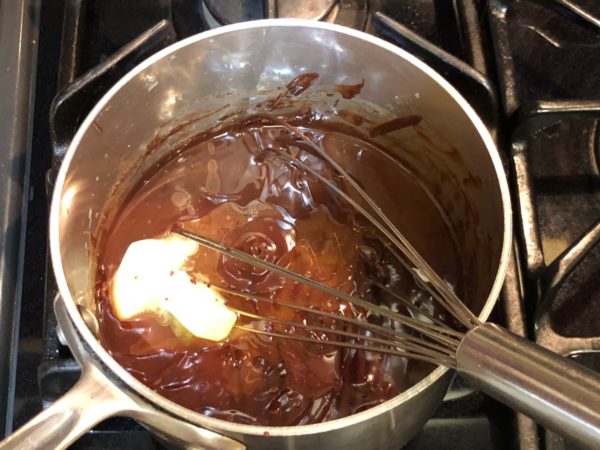 Adding butter and chocolate mint extract.
