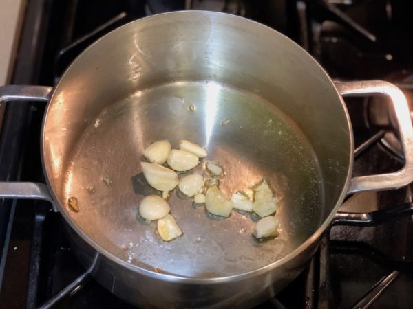 Sauté garlic cloves with olive oil in sauce pan