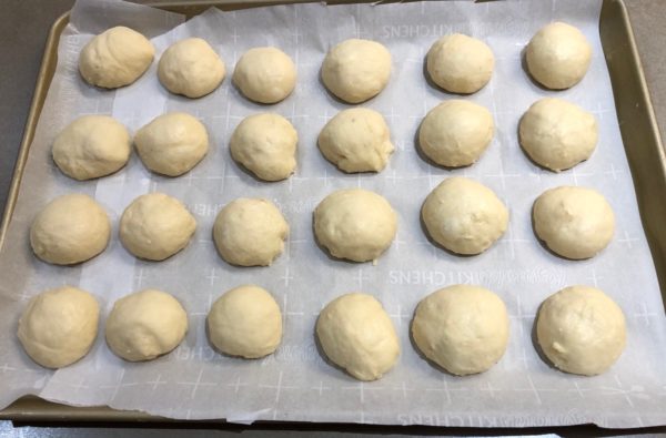 Place the rounded buns onto sheet tray lined with parchment paper.