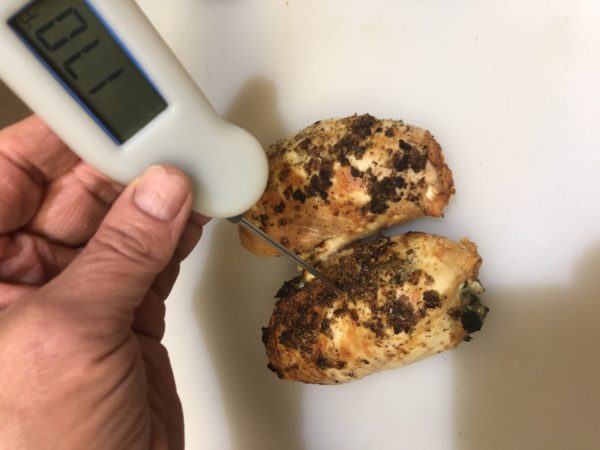 After air frying spinach stuffed chicken breasts, be sure to check the internal temperature. The thermometer should read 170°F. Be sure to stick the probe right in center of the stuffed chicken to make sure the filling reaches 170°F.