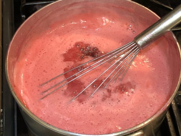 Bring berry vinegar and apple juice in sauce pan.