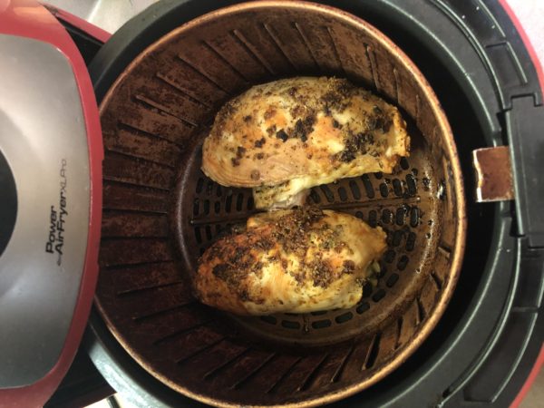 Air Fried Spinach Stuffed Chicken Breast coming out of Air Fryer. See that wonderful golden brown color, that’s still in the Air Fryer basket.