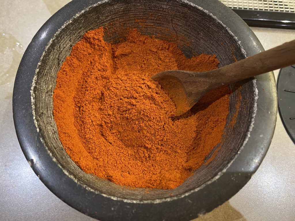Fresh ground paprika chilies into bright red color